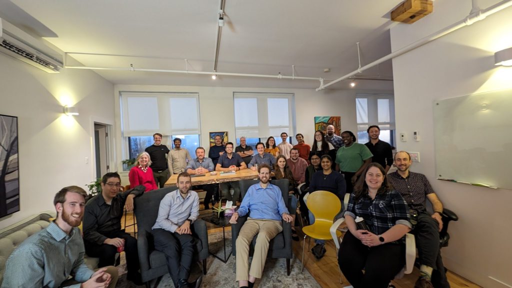 Four Eyes team group photo in the office lounge