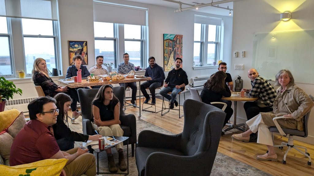 Four Eyes team relaxing together in the office lounge